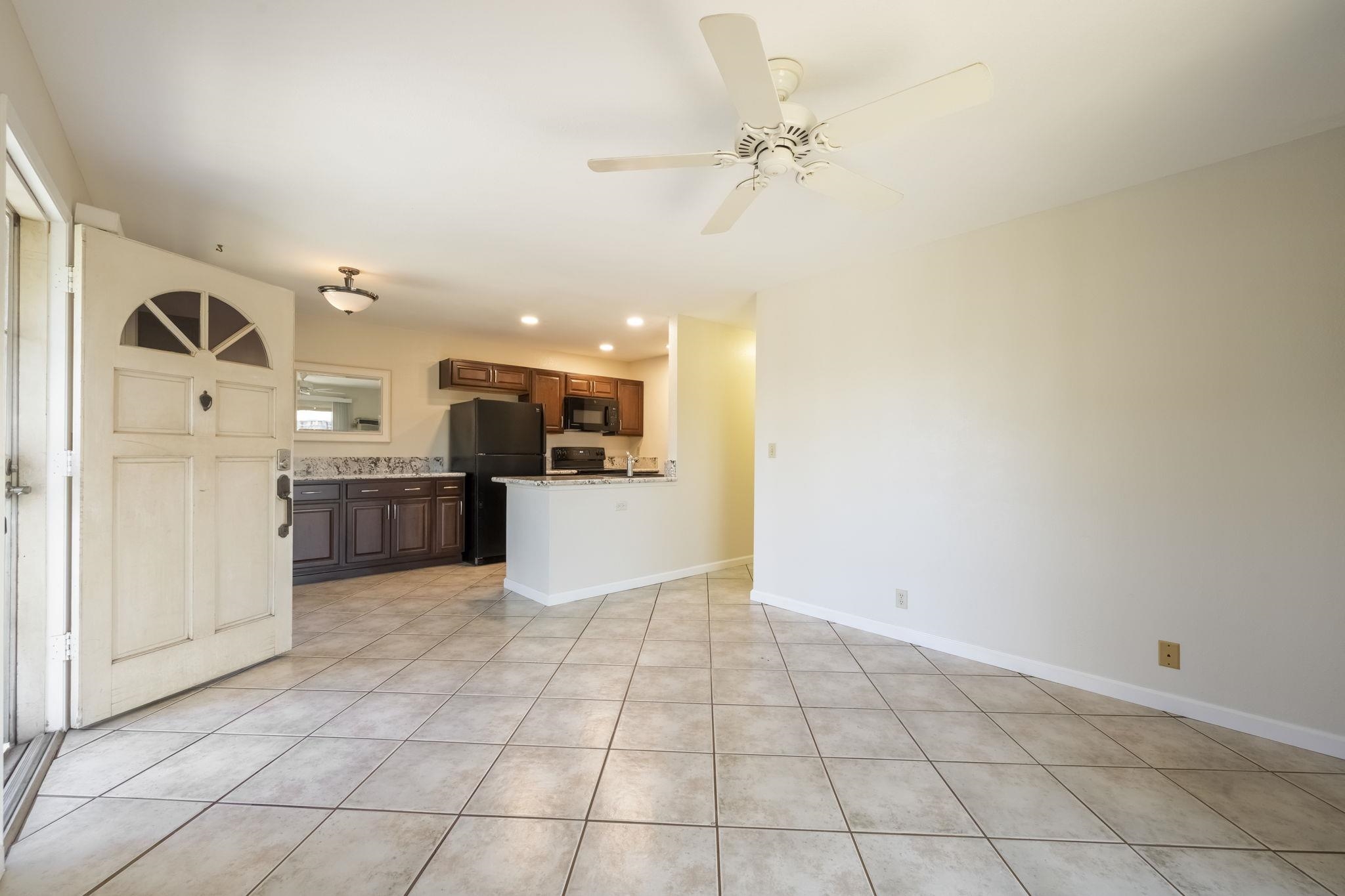 480 Kenolio Road, Unit 31205 Kihei, HI 96753 - Photo 9 of 45 a view of a kitchen with a sink and cabinets