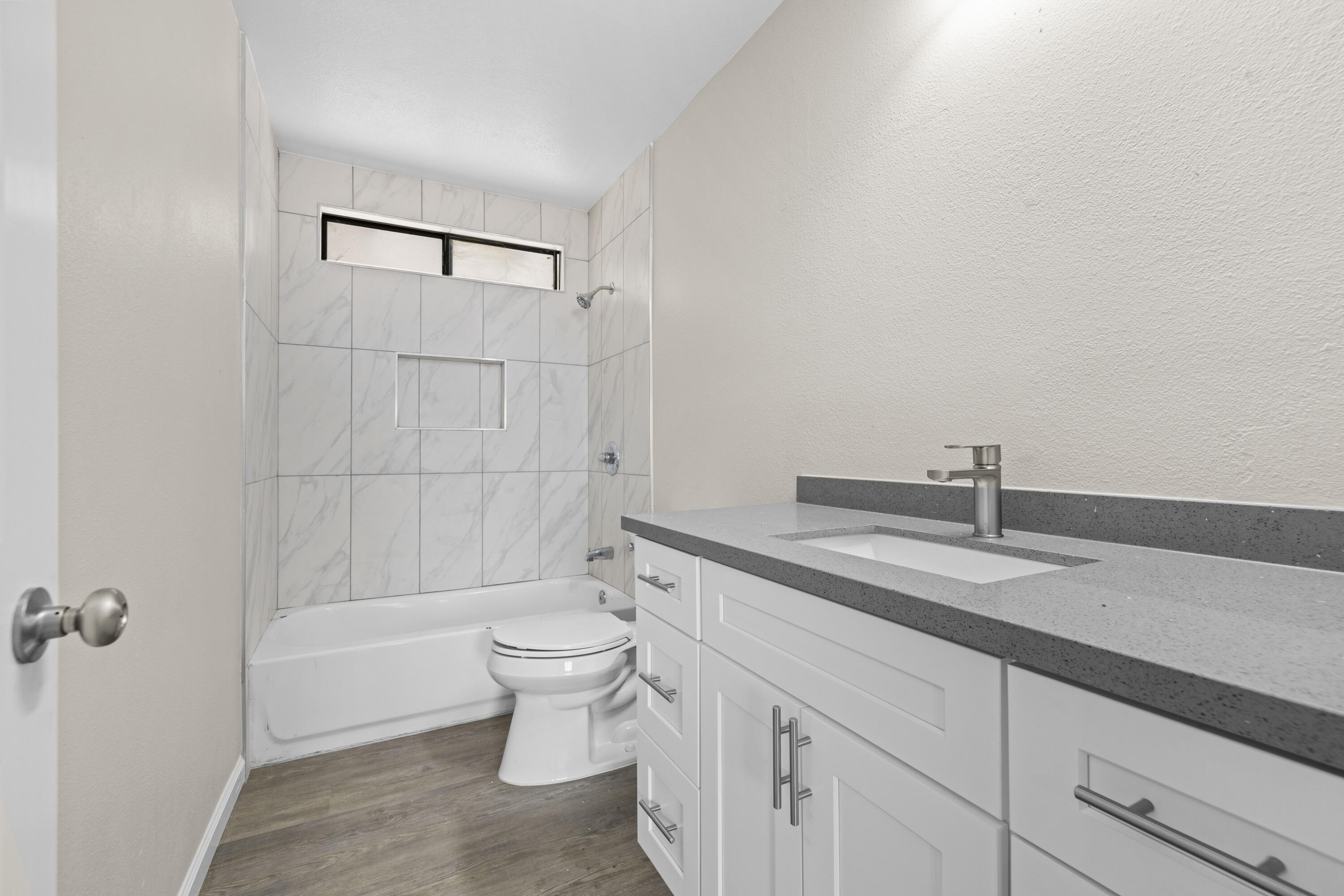 1270 Ave H4 Lancaster, CA 93534 - Photo 13 of 39 a bathroom with a sink a toilet and shower