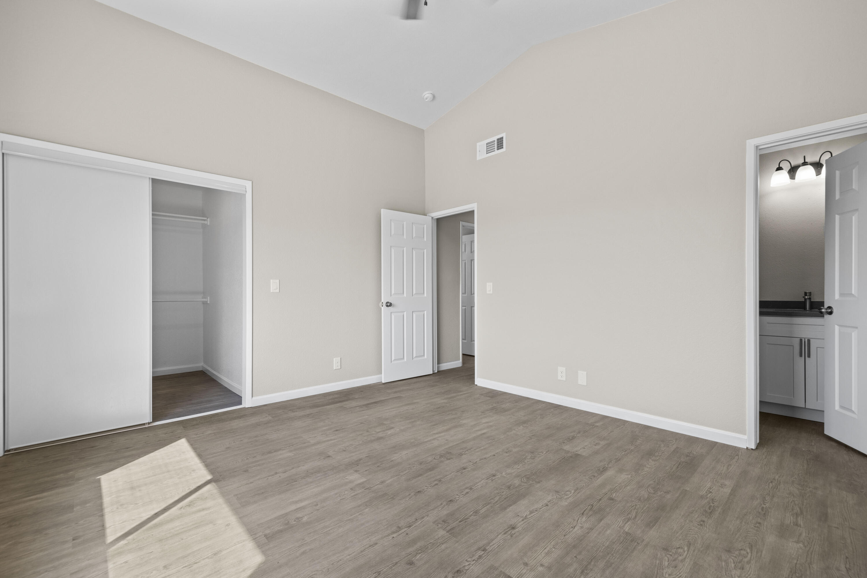 1270 Ave H4 Lancaster, CA 93534 - Photo 20 of 39 a view of an empty room with a kitchen