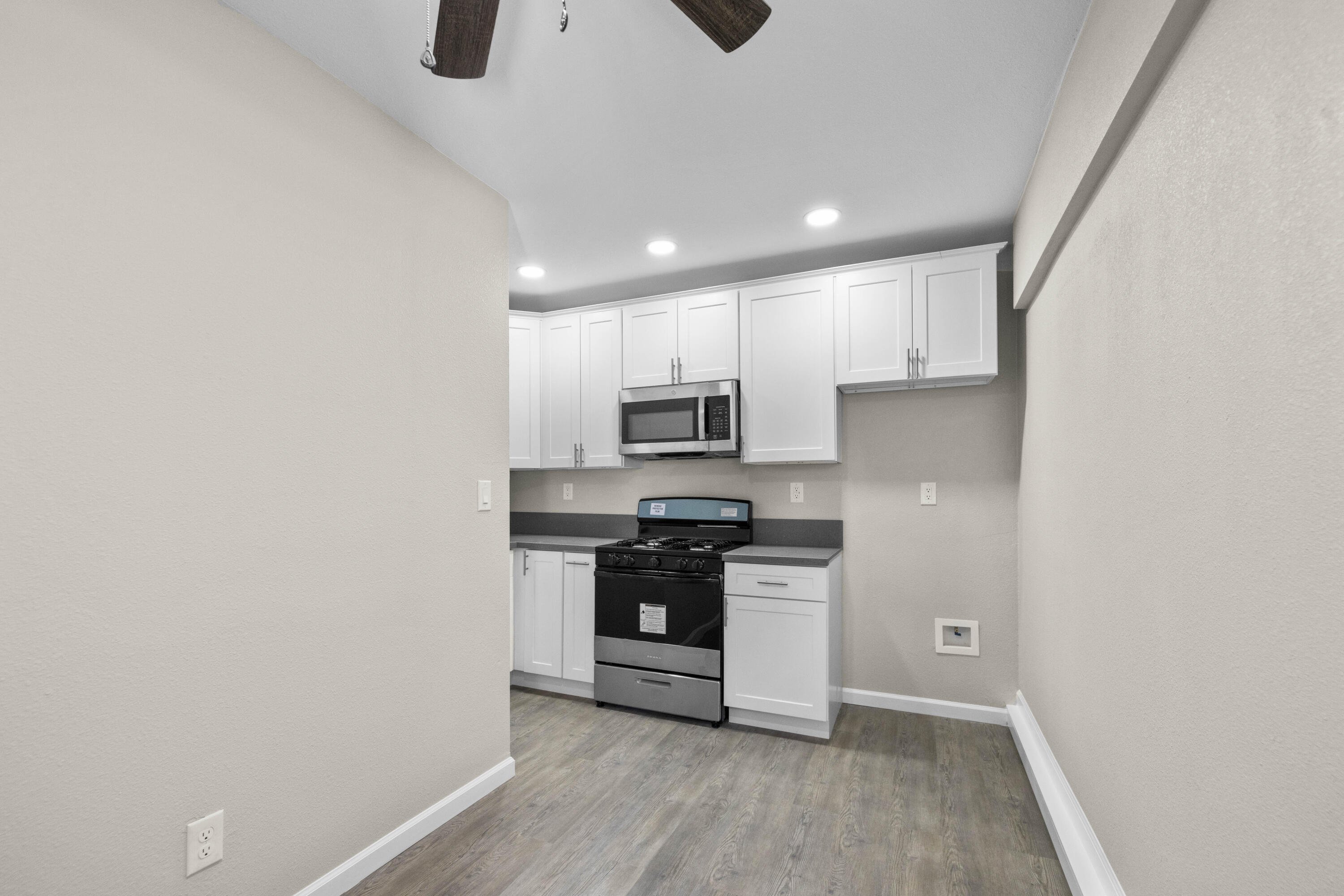 1270 Ave H4 Lancaster, CA 93534 - Photo 31 of 39 a kitchen with stainless steel appliances a refrigerator and a stove top oven