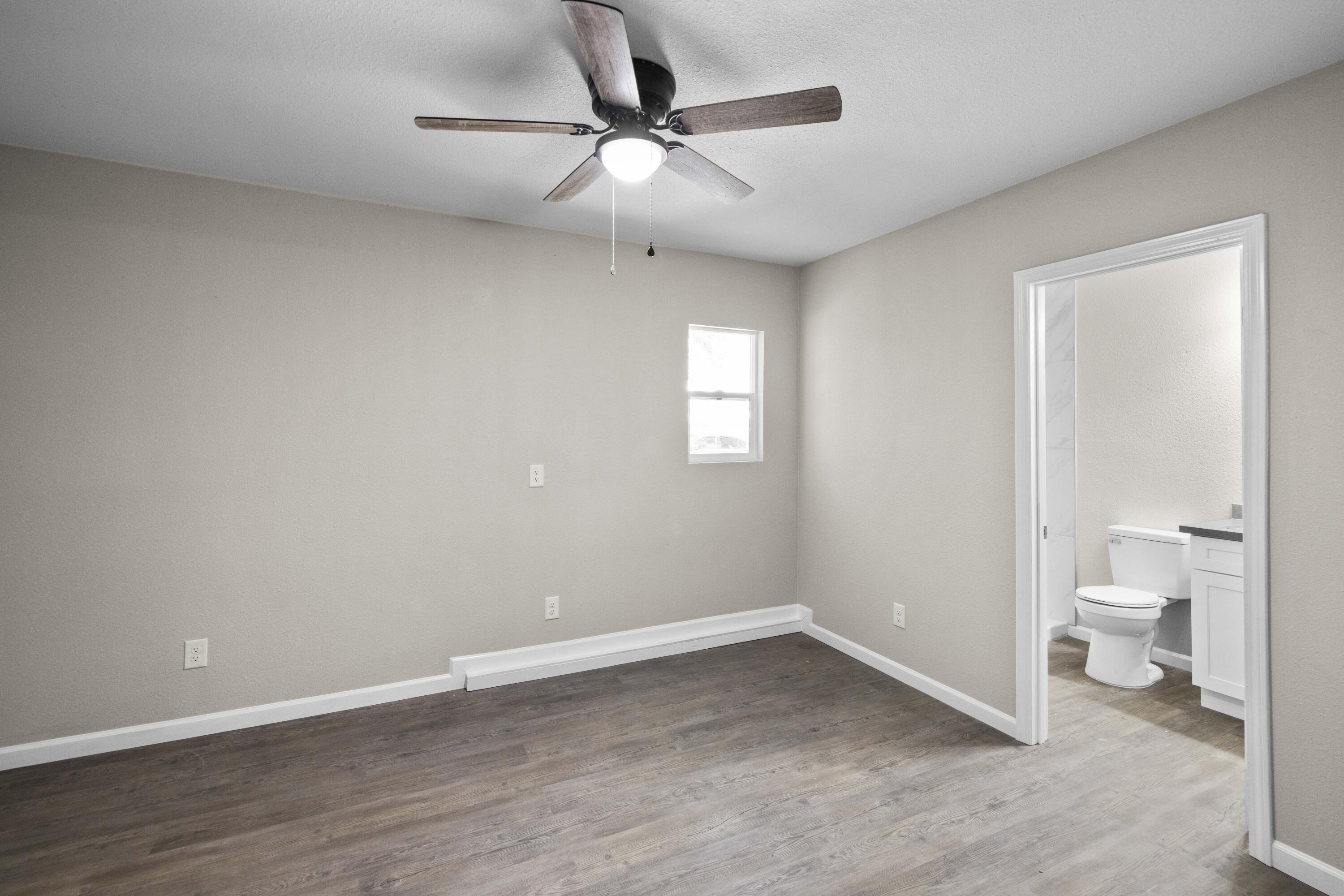 1270 Ave H4 Lancaster, CA 93534 - Photo 33 of 39 an empty room with a bathroom