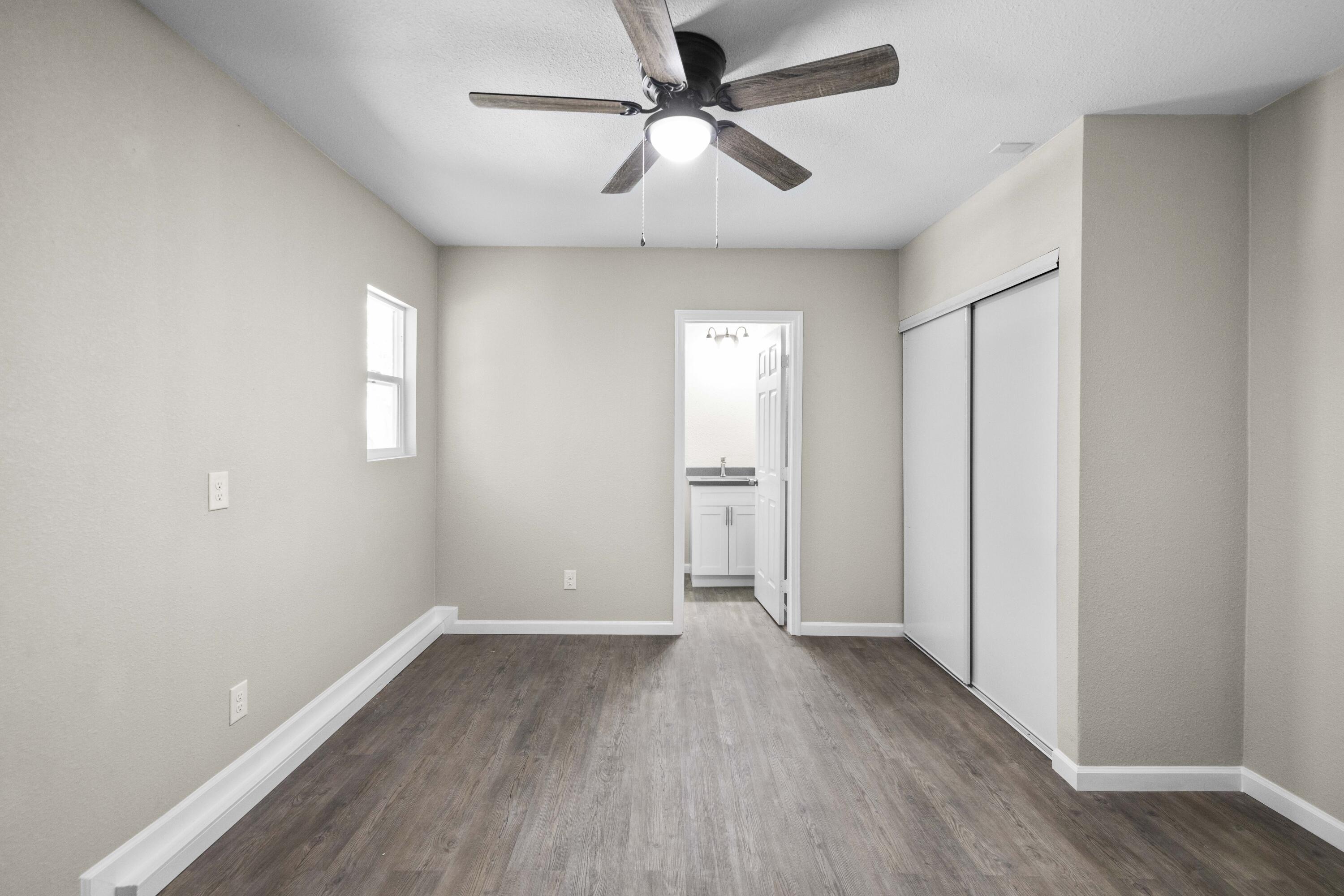 1270 Ave H4 Lancaster, CA 93534 - Photo 34 of 39 wooden floor in an empty room with a window