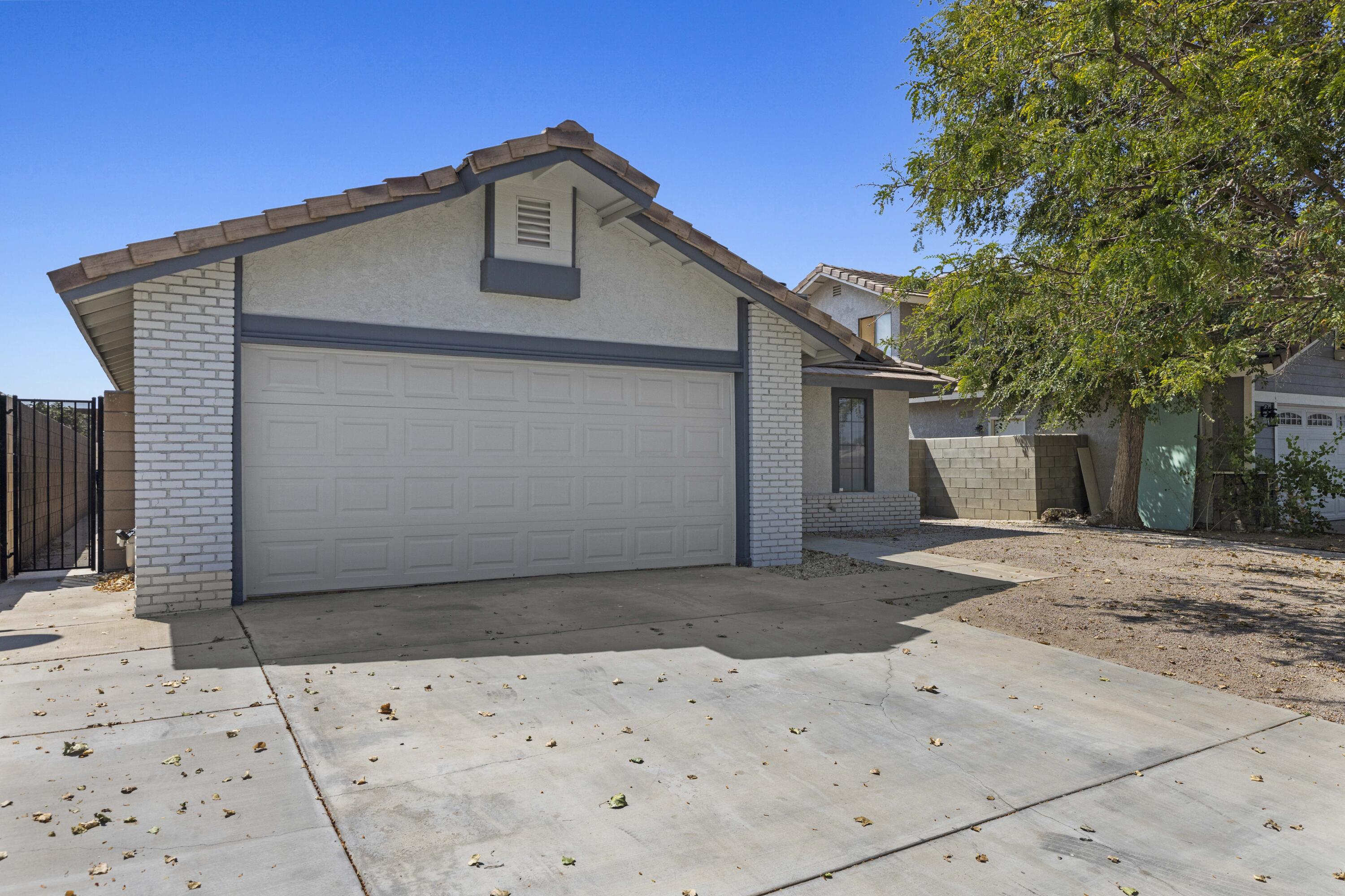 1270 Ave H4 Lancaster, CA 93534 - Photo 39 of 39 a front view of a house with a yard