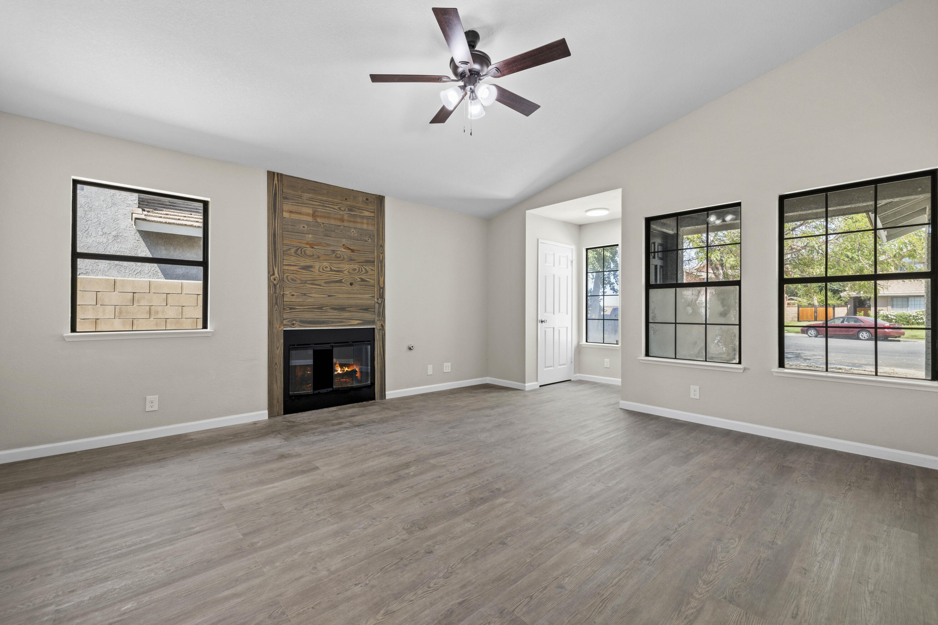 1270 Ave H4 Lancaster, CA 93534 - Photo 4 of 39 a view of an empty room with a window and a fireplace