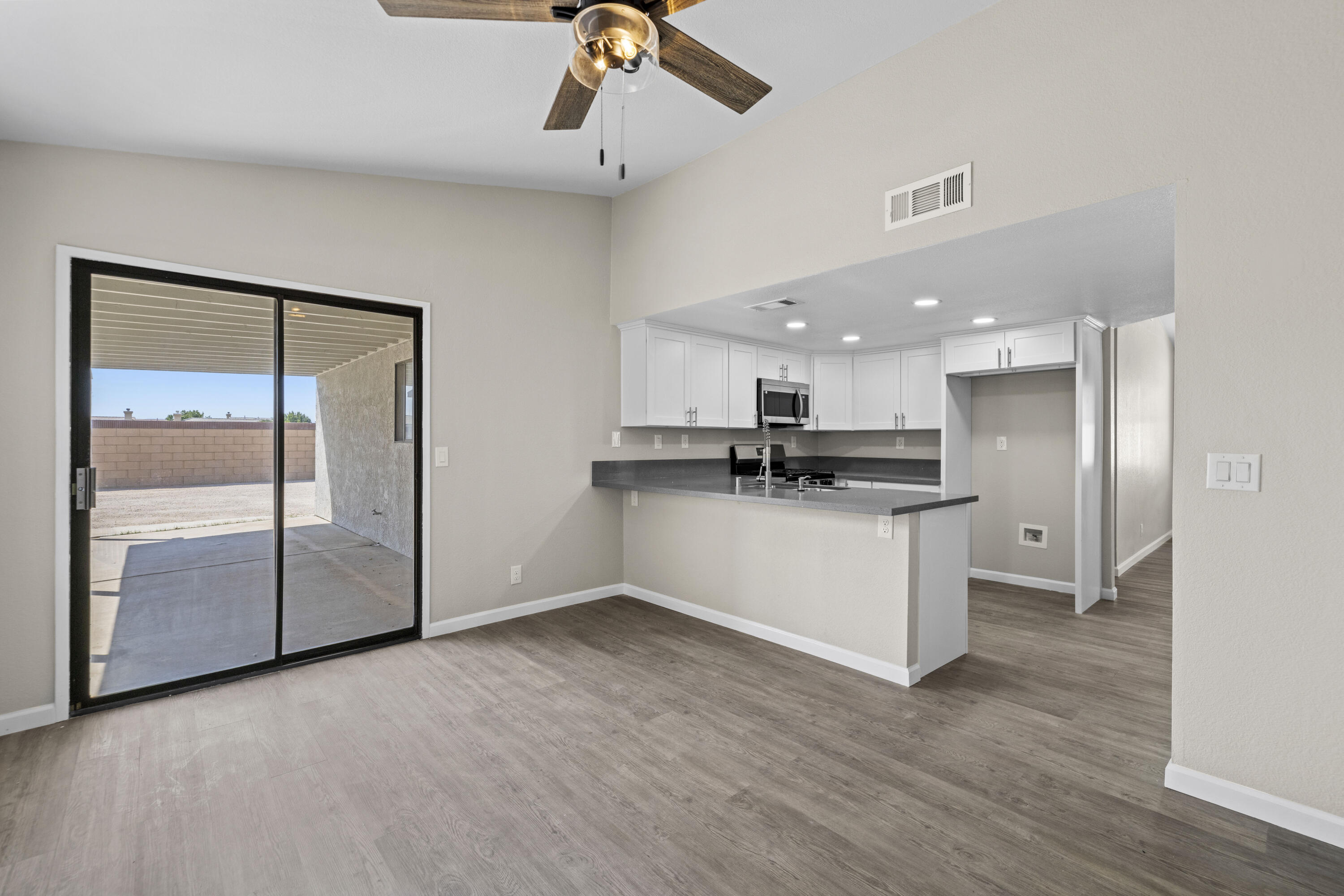 1270 Ave H4 Lancaster, CA 93534 - Photo 8 of 39 a view of kitchen with stainless steel appliances kitchen island refrigerator stove and cabinets