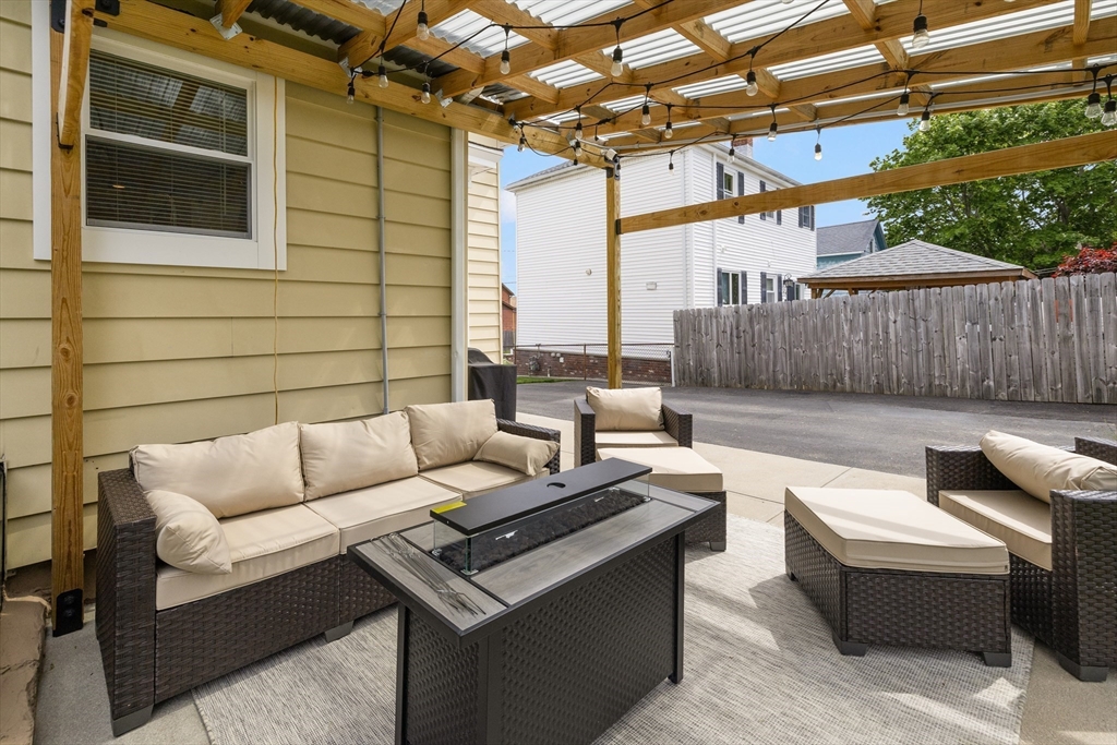 69 Denver Street Fall River, MA 02721 - Photo 8 of 35 a view of a patio with couches and a table and chairs