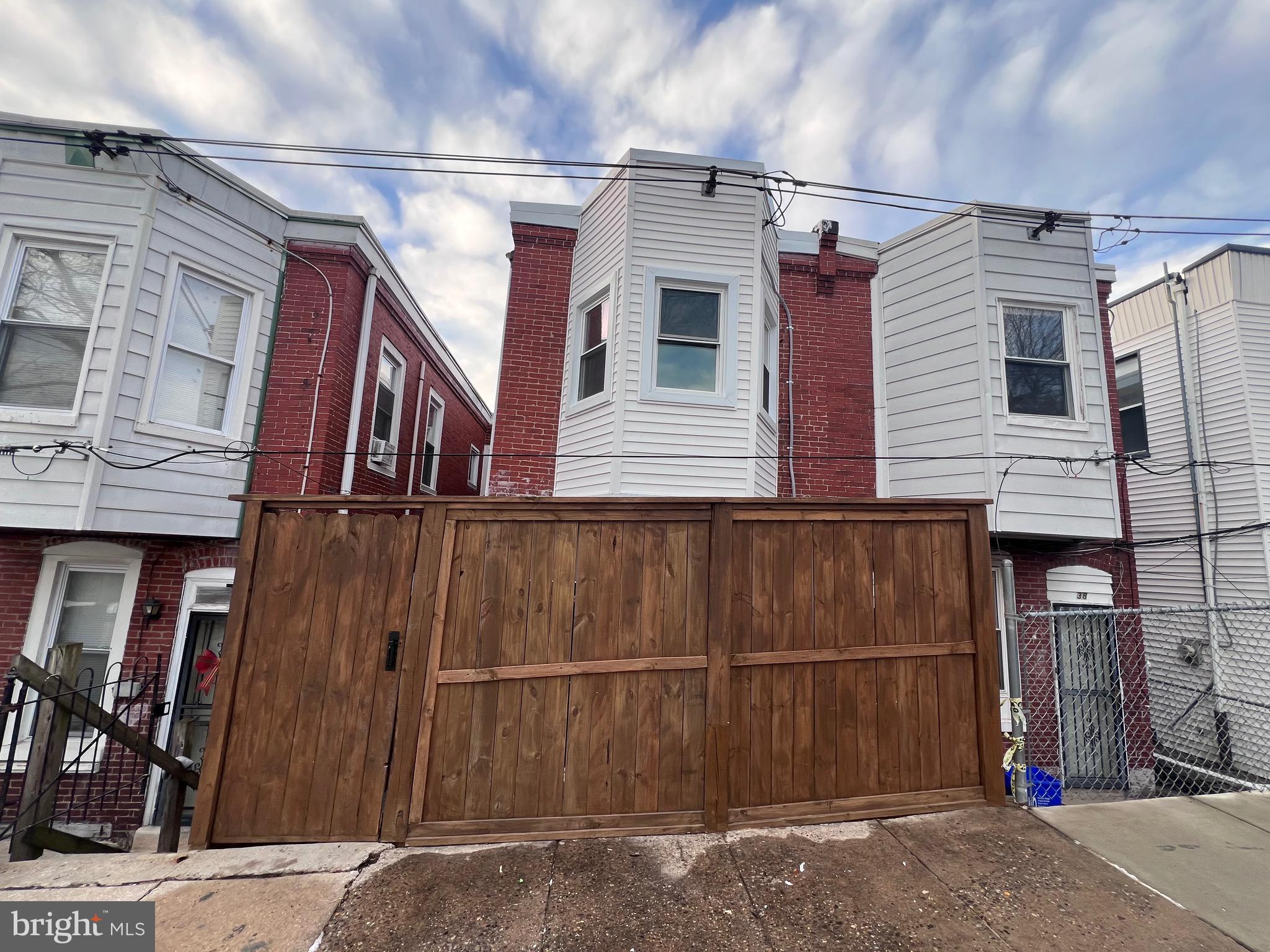 40 West Sharpnack Street Philadelphia, PA 19119 - Photo 11 of 18 a view of a street with house