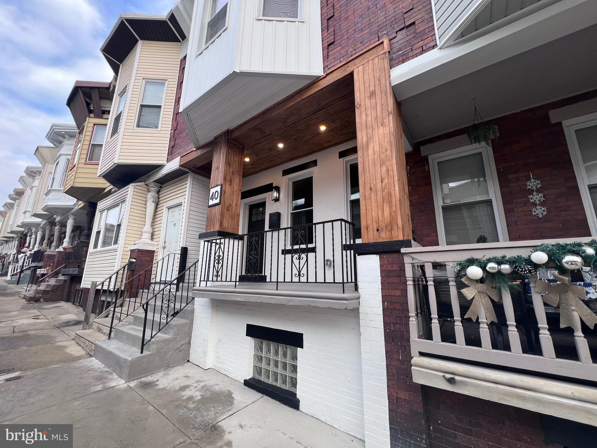 40 West Sharpnack Street Philadelphia, PA 19119 - Photo 5 of 18 a view of front red house