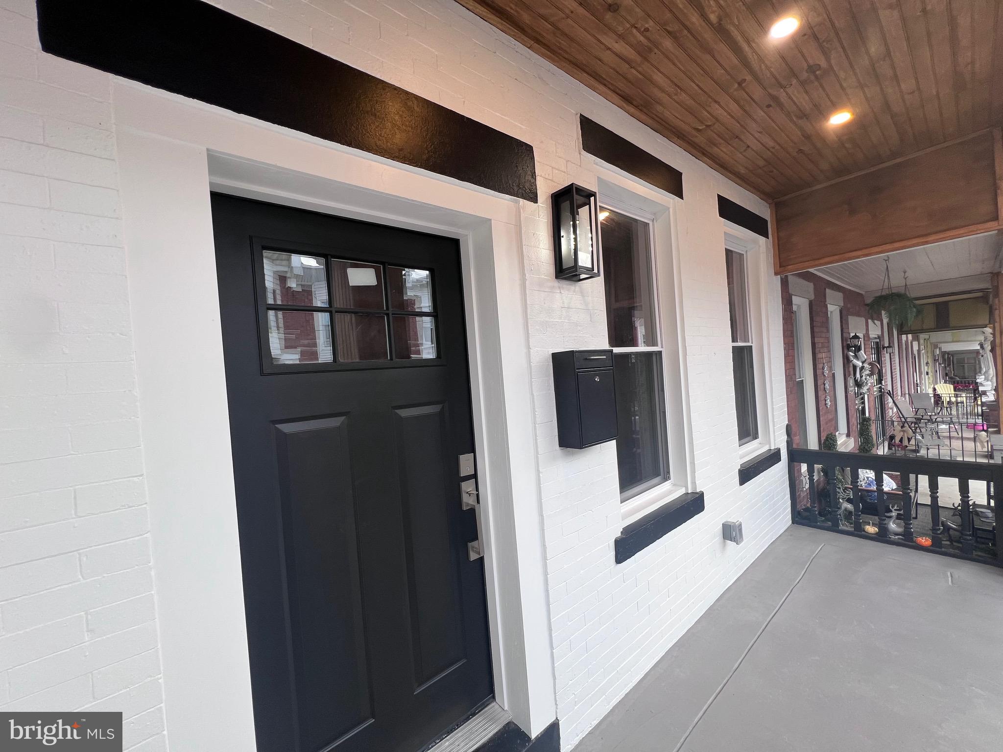 40 West Sharpnack Street Philadelphia, PA 19119 - Photo 7 of 18 a view of livingroom with furniture and stairs