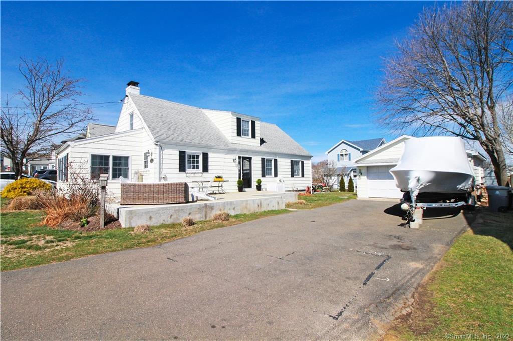 254 Giants Neck Road East Lyme, CT 06357 - Photo 1 of 1 a front view of a house with a yard and porch
