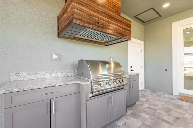 a kitchen with a stove and a sink