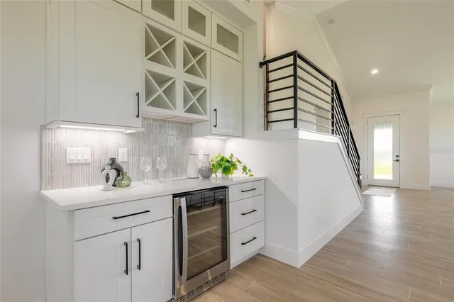 a kitchen with cabinets and appliances