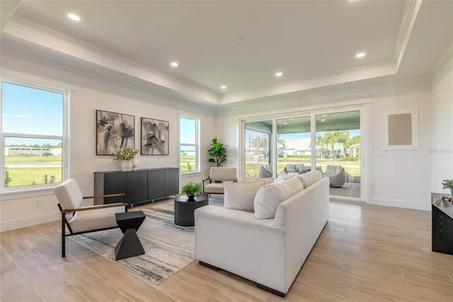 a living room with furniture and a large window