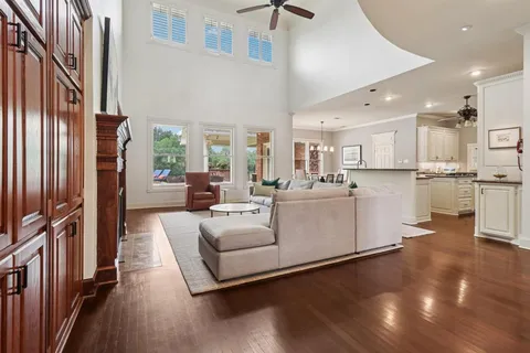 a large white kitchen with lots of counter space a sink and appliances