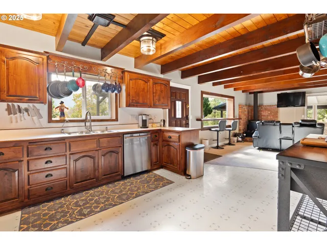 a kitchen with stainless steel appliances granite countertop a stove and a sink