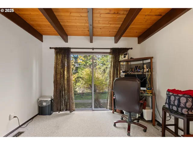a living room with furniture a large window