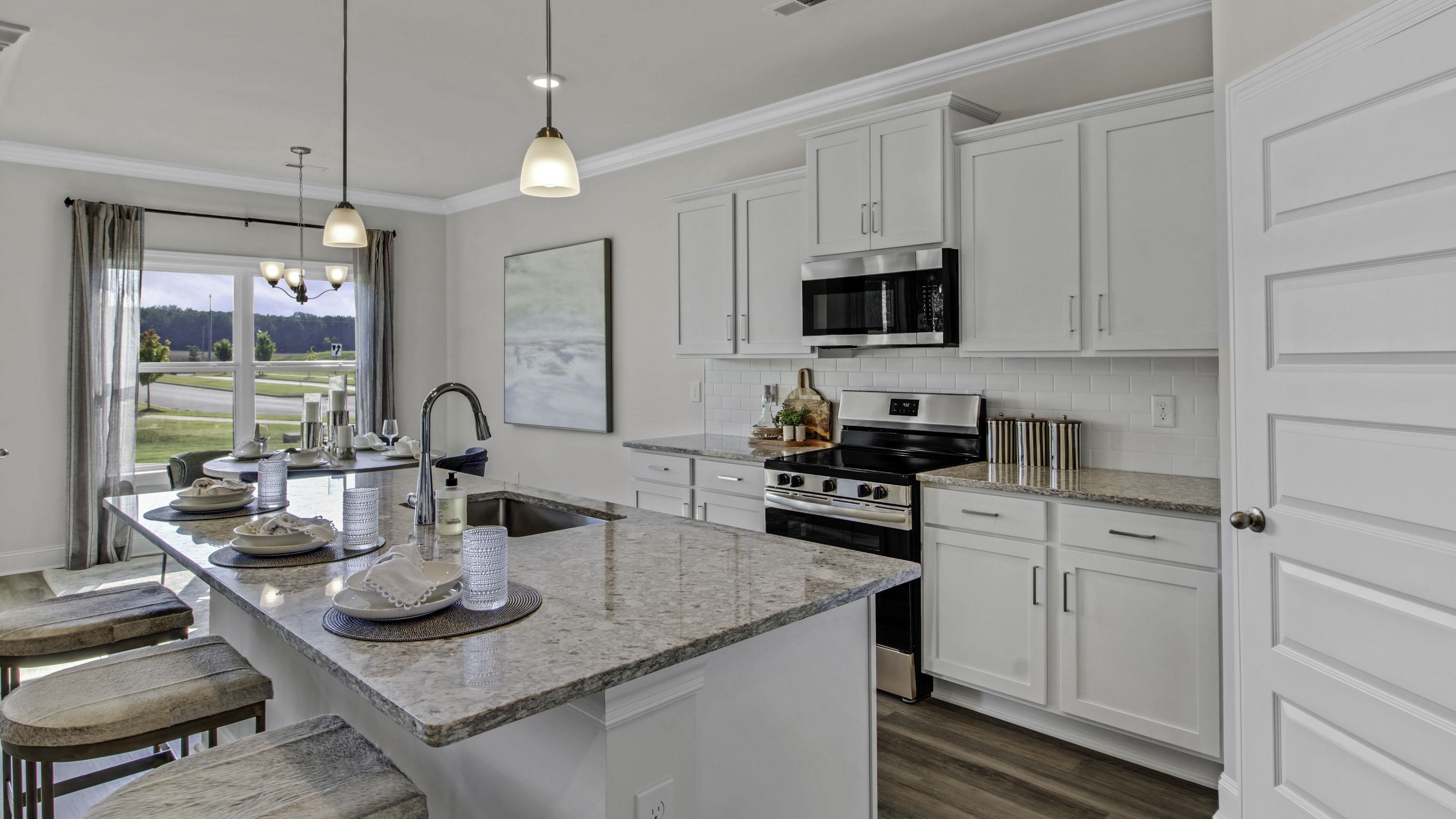 990 Mewborn Farm Road Oakland, TN 38060 - Photo 4 of 40 Kitchen featuring stainless steel appliances, white cabinets, dark wood-style floors, backsplash, and ornamental molding