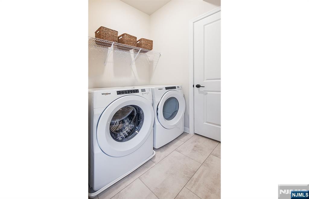 400 Sycamore Street, Unit 405 Kearny, NJ 07032 - Photo 12 of 28 a utility room with dryer and washer