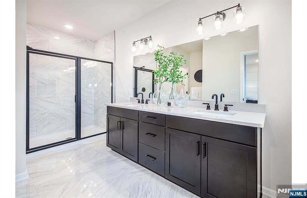 400 Sycamore Street, Unit 405 Kearny, NJ 07032 - Photo 15 of 28 a bathroom with a double vanity sink and mirror