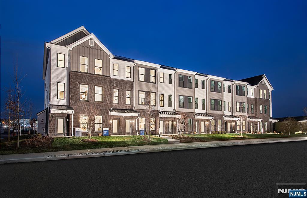 400 Sycamore Street, Unit 405 Kearny, NJ 07032 - Photo 16 of 28 a front view of a building with lake view and trees
