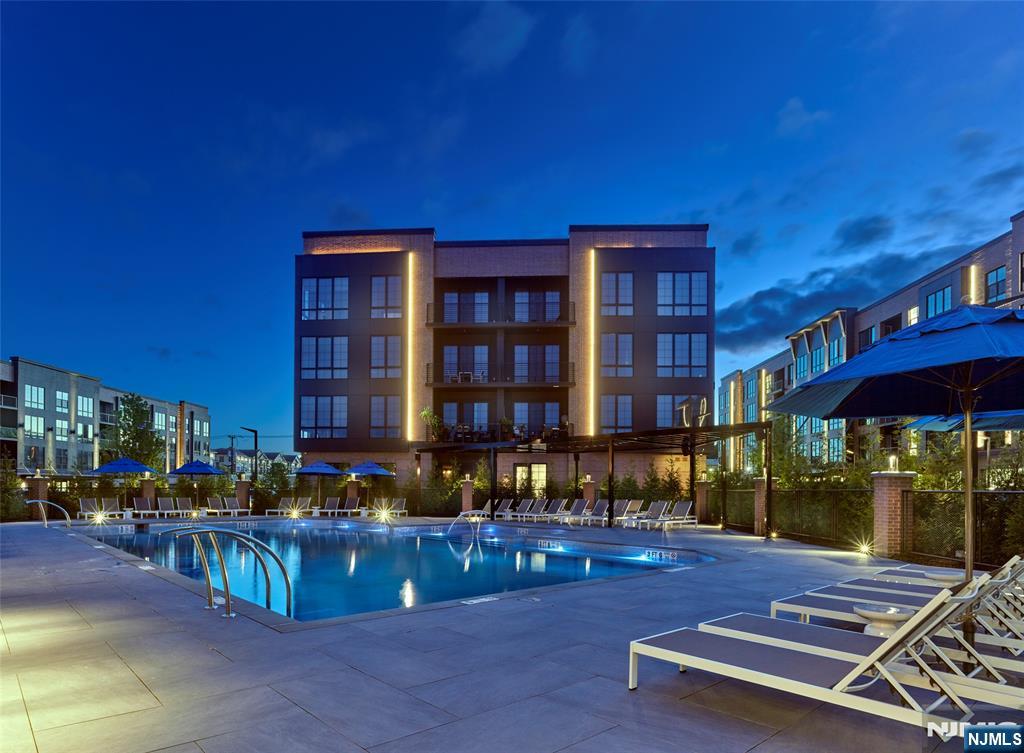 400 Sycamore Street, Unit 405 Kearny, NJ 07032 - Photo 19 of 28 a view of a building with a swimming pool