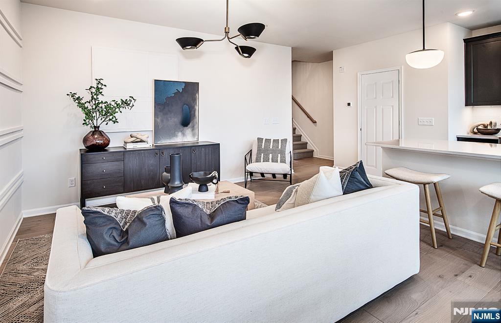 400 Sycamore Street, Unit 405 Kearny, NJ 07032 - Photo 6 of 28 a living room with furniture and a flat screen tv