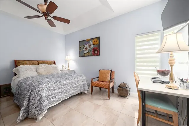 a bedroom with a bed and a desk