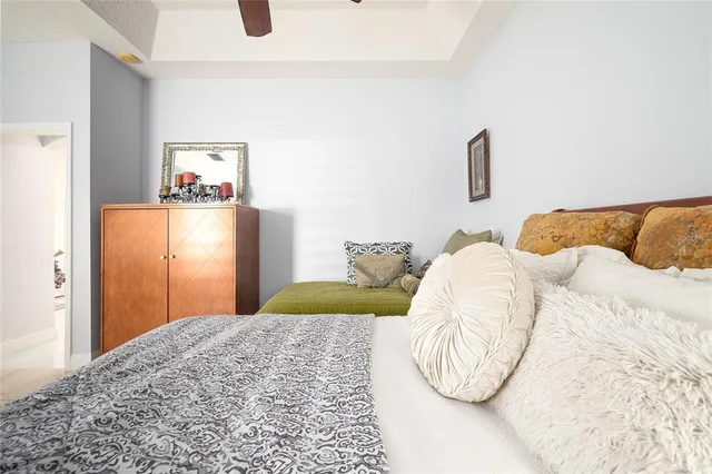 a bedroom with a bed and a couch