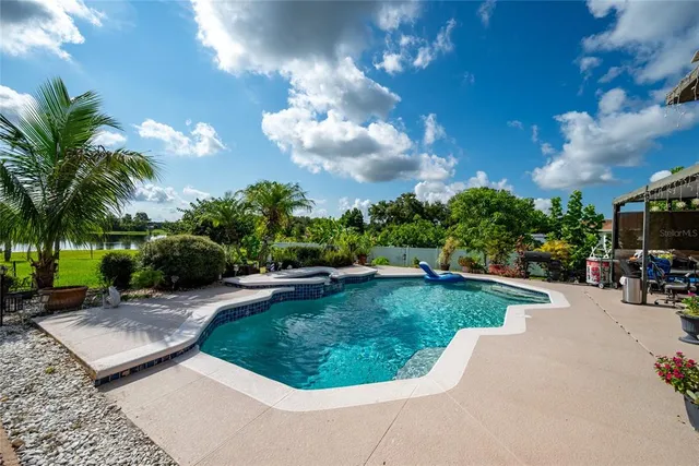 a view of a backyard with sitting area