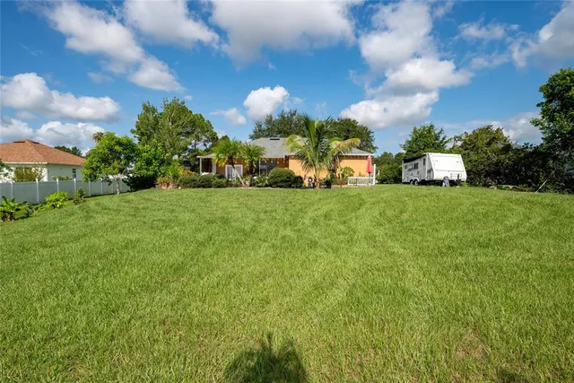 a view of a house with a big yard