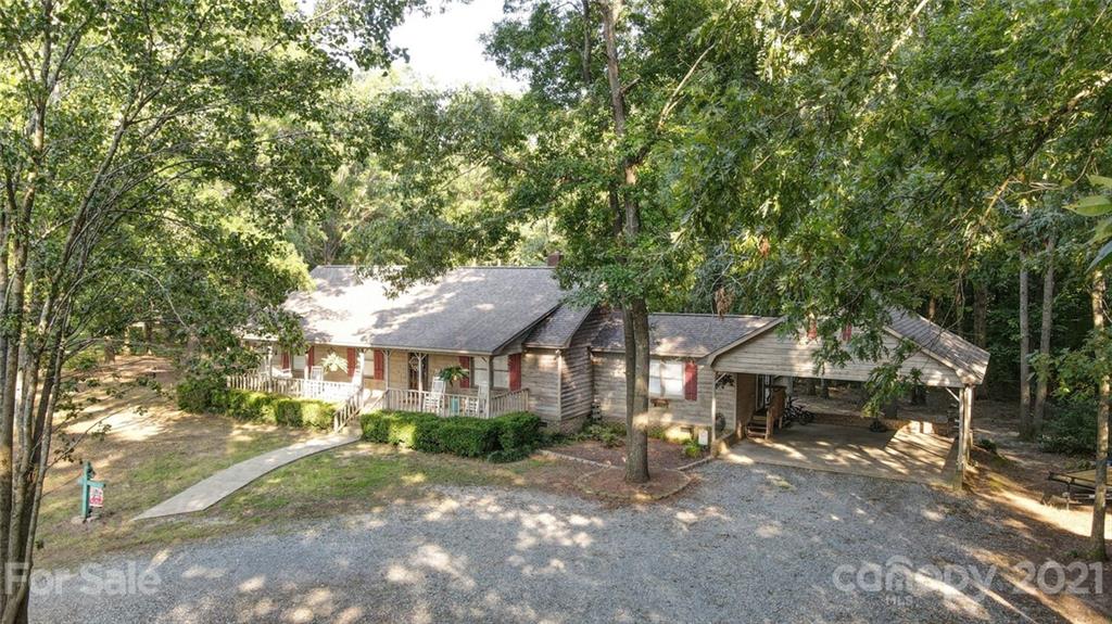 411 Gulledge Parker Road Monroe, NC 28112 - Photo 1 of 29 a front view of a house with a yard