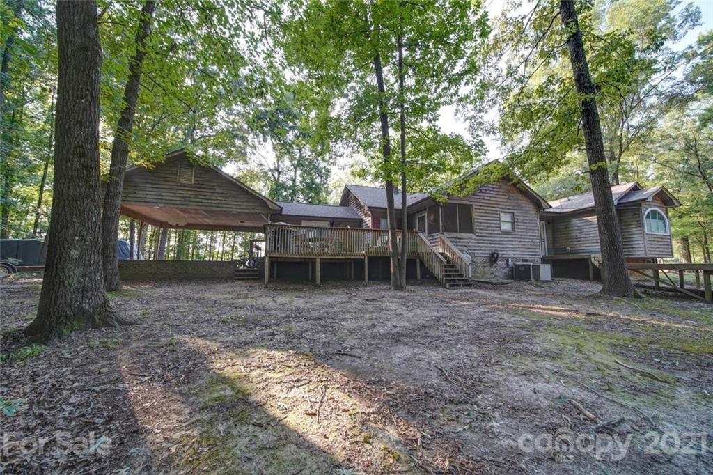 411 Gulledge Parker Road Monroe, NC 28112 - Photo 22 of 29 a view of a house with a yard and large tree