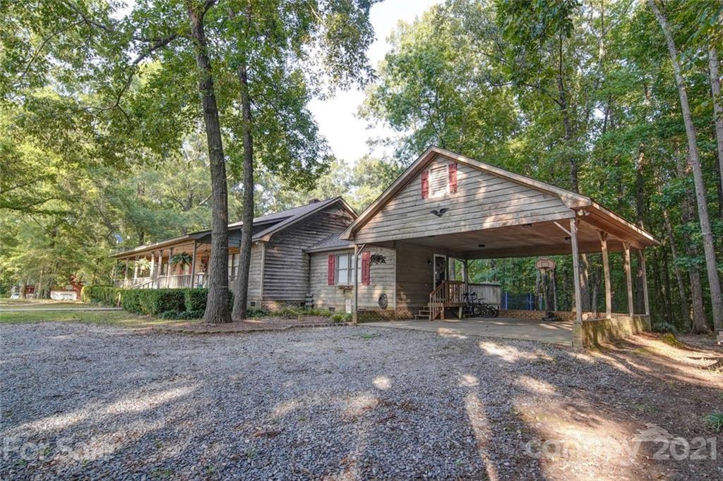 411 Gulledge Parker Road Monroe, NC 28112 - Photo 26 of 29 a front view of house with yard and trees around