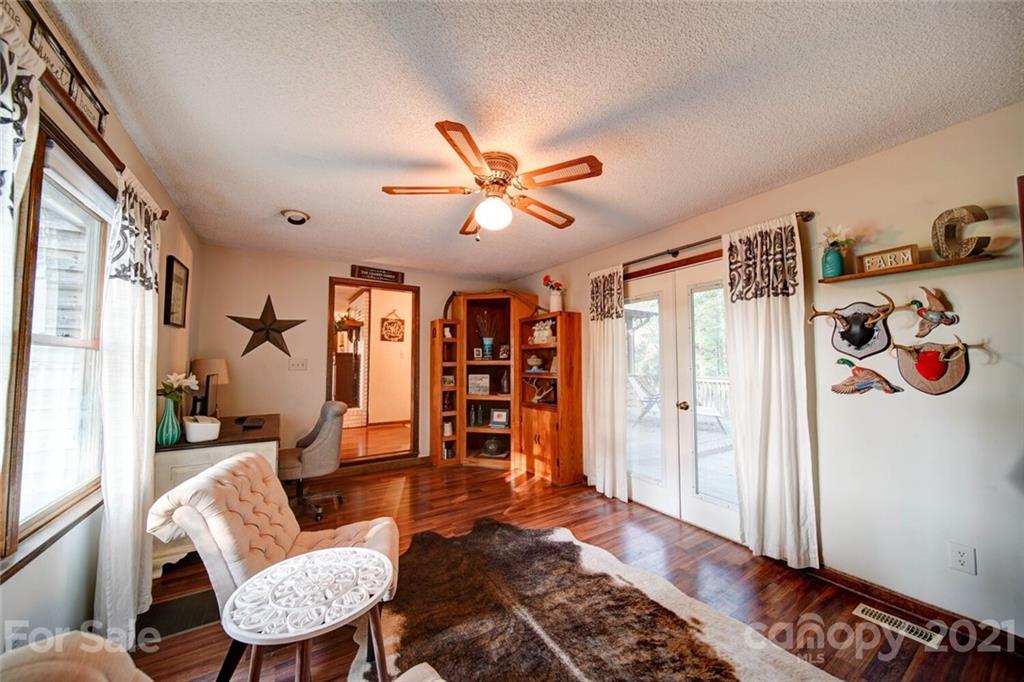 411 Gulledge Parker Road Monroe, NC 28112 - Photo 8 of 29 a living room with furniture and wooden floor
