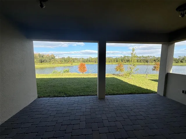 a view of a porch and garden