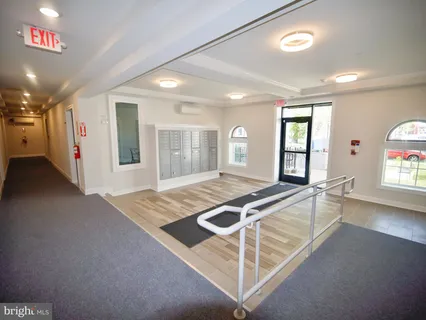 a room with gym equipment and windows