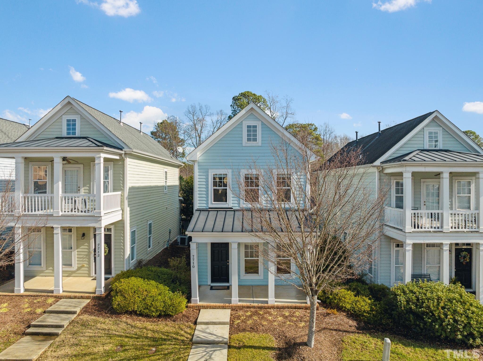 7710 ACC Boulevard Raleigh, NC 27617 - Photo 1 of 33 a front view of a house with a yard