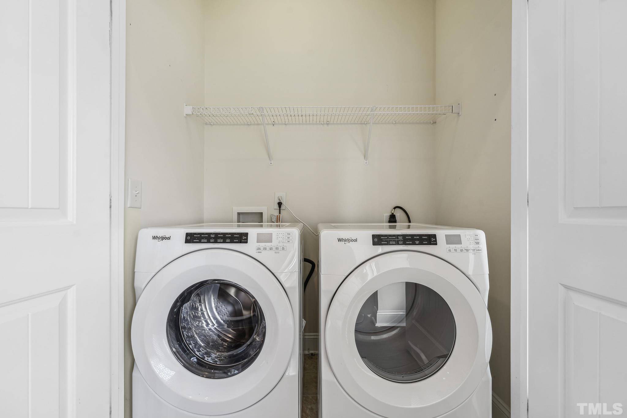 7710 ACC Boulevard Raleigh, NC 27617 - Photo 16 of 33 a utility room with dryer and washer