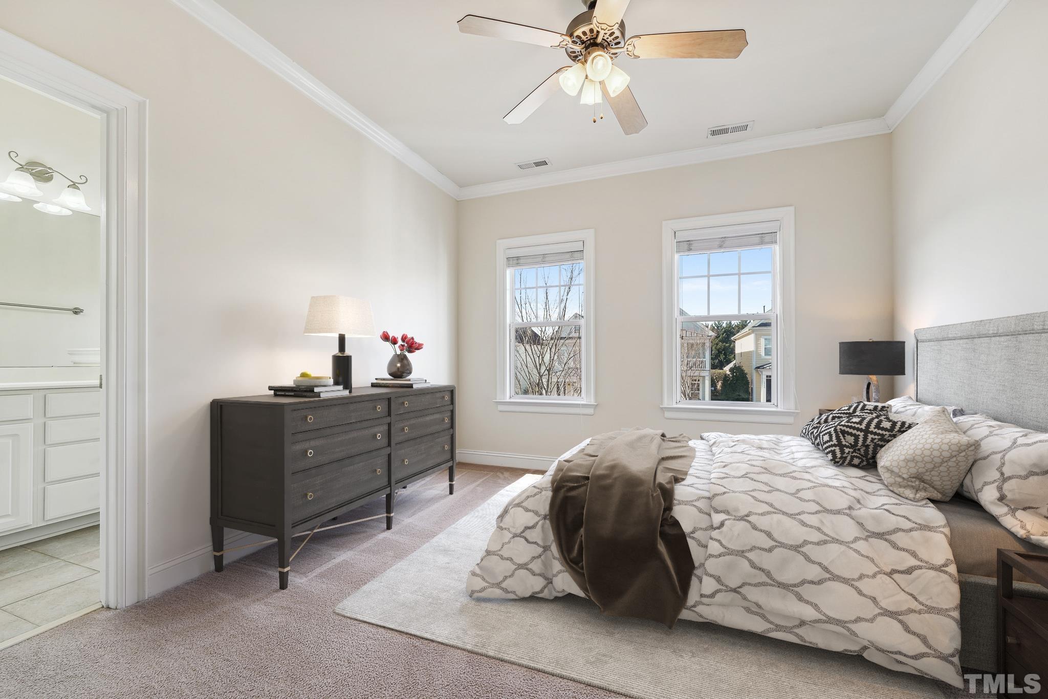 7710 ACC Boulevard Raleigh, NC 27617 - Photo 17 of 33 a bedroom with a bed and window