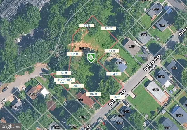 an aerial view of multiple houses with yard