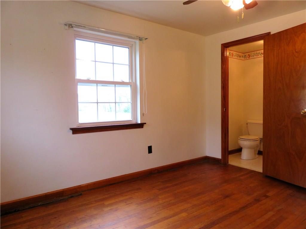 294 Sportsmen Road Hunker, PA 15639 - Photo 10 of 19 Main floor bedroom with half bath