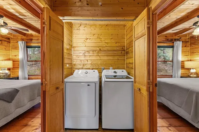 a bedroom with a large bed and a window