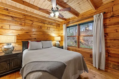 a bathroom with a sink mirror vanity and toilet