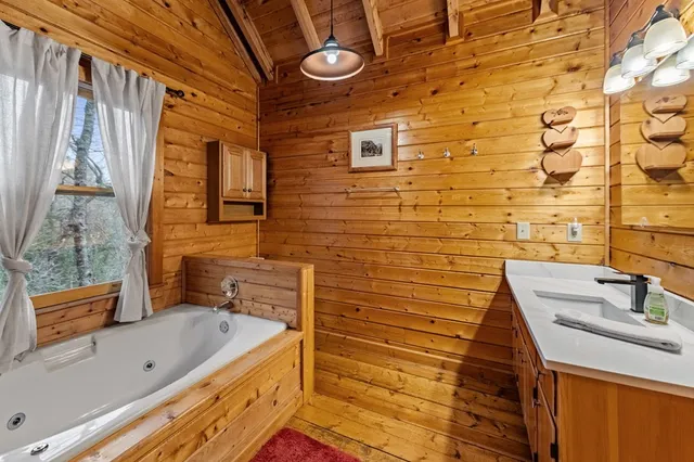 a view of balcony with wooden floor and fence