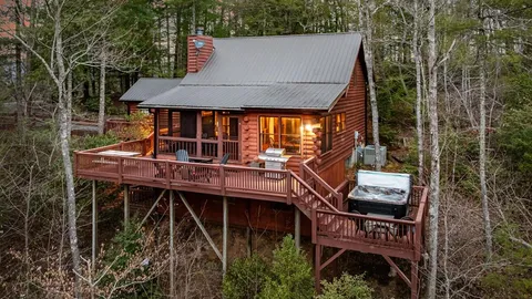 an aerial view of a house with balcony and outdoor space