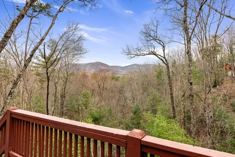 a view of a forest from a balcony