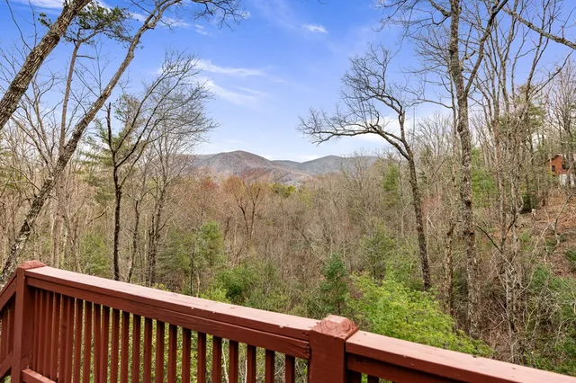 a view of a forest from a balcony