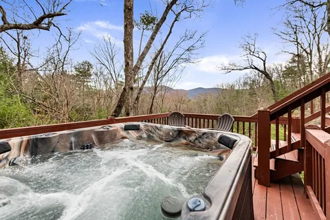 a view of balcony with wooden floor and fence