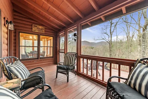 a view of a balcony with furniture