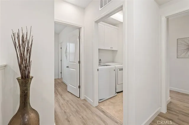 a view of a hallway with wooden floor and a hallway